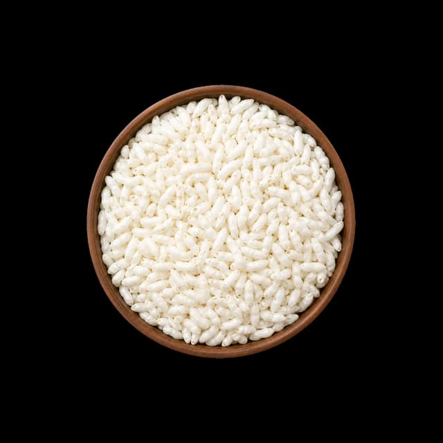 A wooden bowl of light white puffed rice